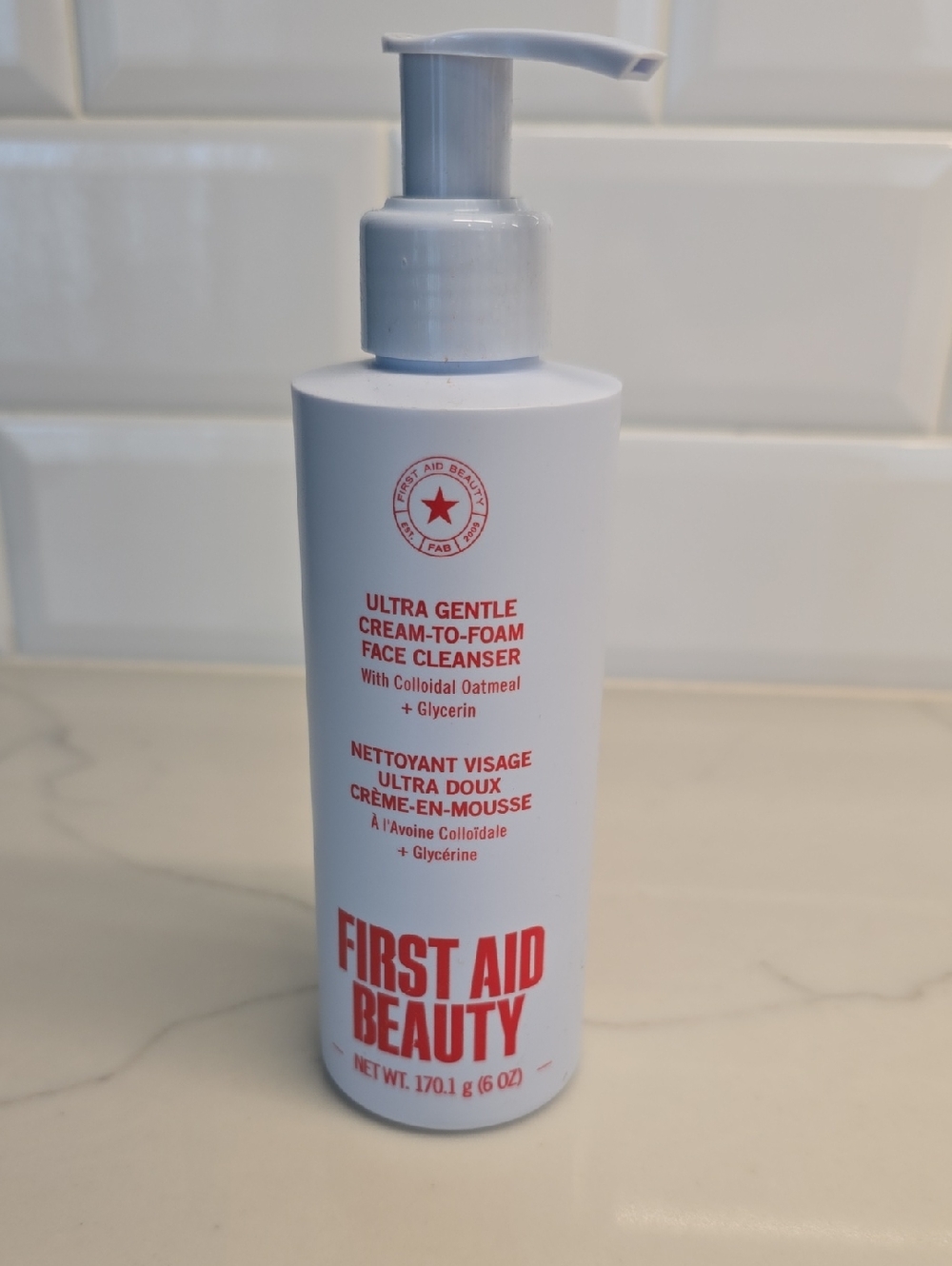 First Aid Beauty White Bottle with Red Text Ultra Gentle Cleanser